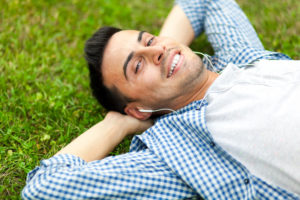 Young man relaxing on the grass